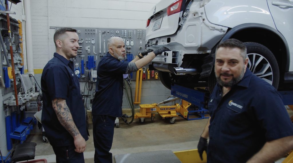 Recruitment Video Thumbnail: VIVE Employees working on vehicle and smiling